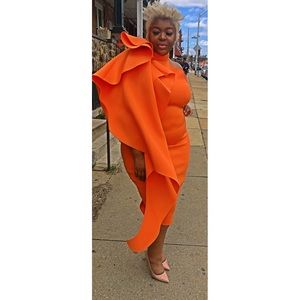 Orange dress ruffled detail. Sizes 1x - 3x